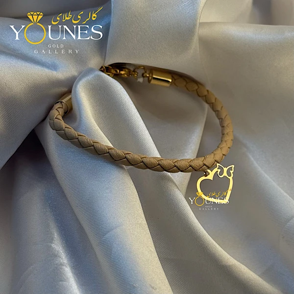 دستبند چرم کرمی پروانه قلبی طلا